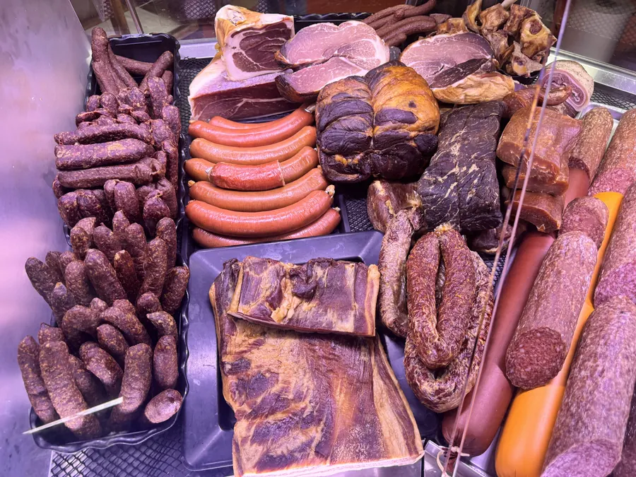 Smoked sausages, salami, and cured meats in the deli case