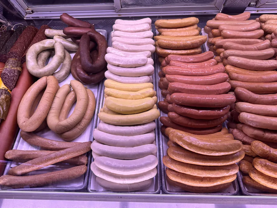 Wide selection of bratwurst, frankfurters, and smoked links