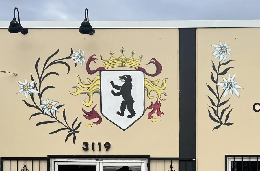 Edelweiss crest and edelweiss flowers painted on the storefront